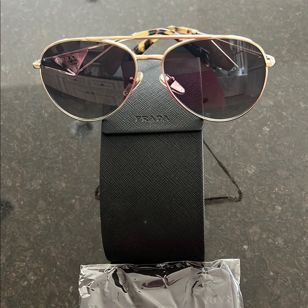 Brand New Prada Gold and Black Aviator Sunglasses with Sleek Design
